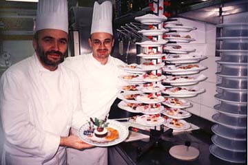 Chef Renato Piccolotto, left, and one of his talented pastry chefs show off a favorite dessert. � Sharon Lloyd Spence and Diana Schuster.