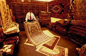 Every store had magnificent rugs piled high to the ceiling. � Warren Lieb.